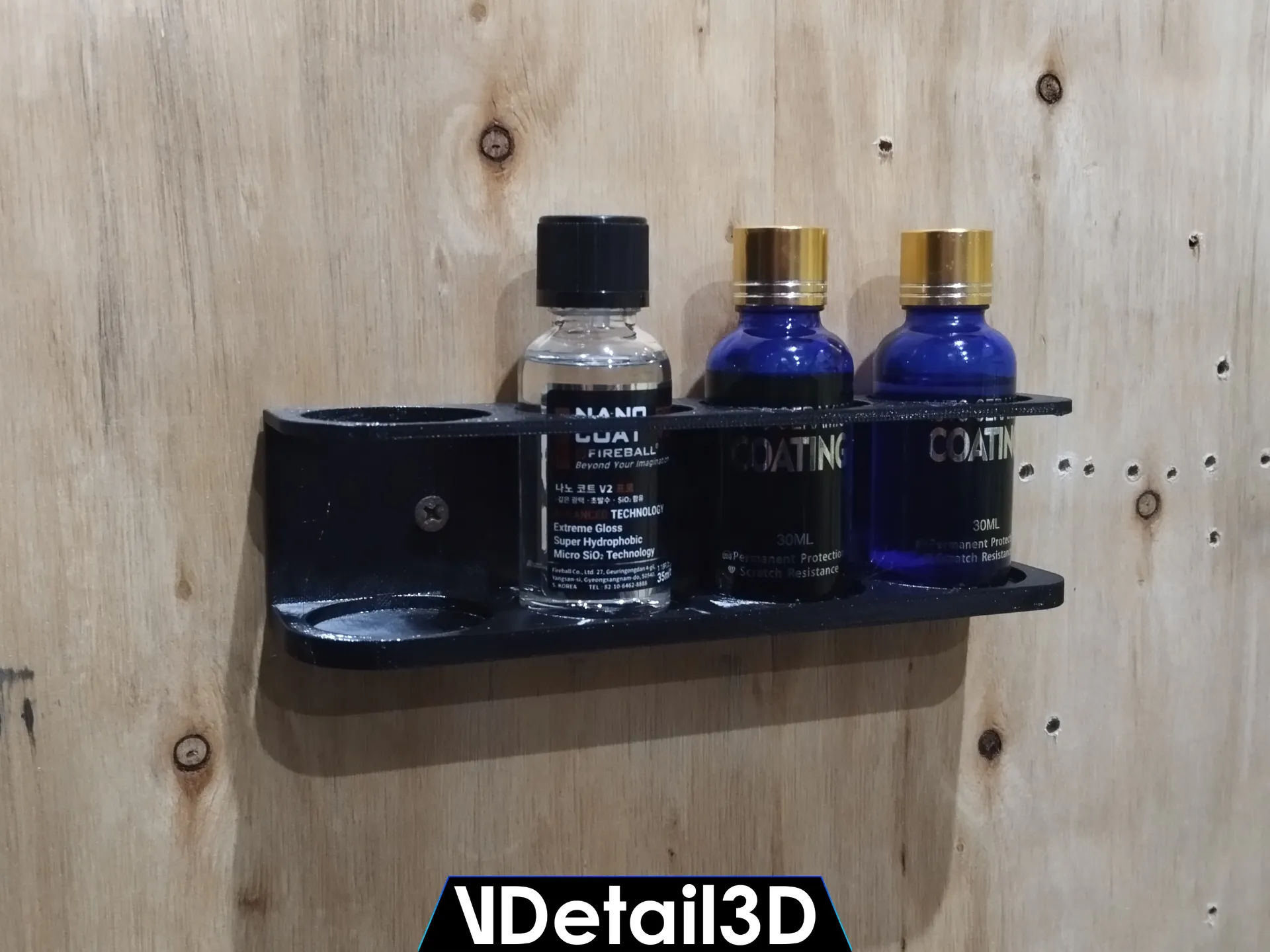 PLA vs PETG: Choosing Material for Printed Organisers 2 Black wall-mounted coating shelf with four positions and three demonstration bottles