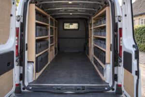 Illustration of a parked work van with side shelving, closed cases and a clear central aisle